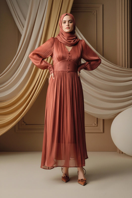 Woman wearing a rust-colored dress against a beige background