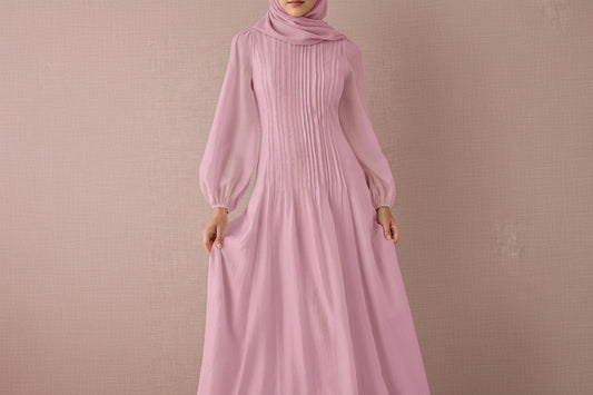 Pink ribbed dress with long sleeves on a beige background